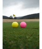 Discover yellow and pink golf balls,