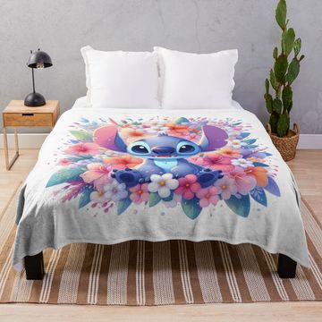 Discover Stitch sitting with a beautiful bouquet of flowers Throw Blanket