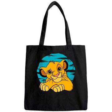 Discover The Lion King Young Simba Resting Blue 90s Tote Bag
