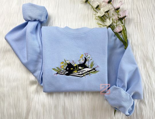 Embroidered Cute Cat Lying On Book With Flower Sweatshirt | Flower With Cat Embroidered | Book Lover T-Shirt | Crew Neck Sweatshirt