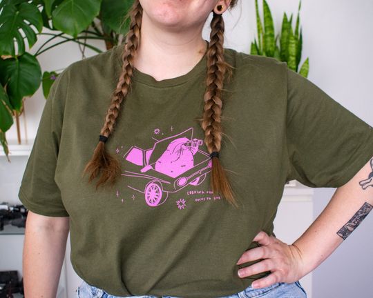 Looking for fucks to give cat t-shirt | Hand screen printed olive green organic cotton tee with pink illustration of a cat with binoculars