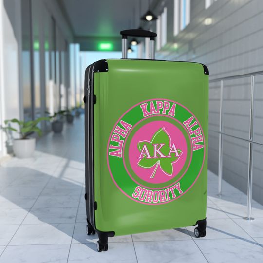 Cute Alpha Kappa Sorority Suitcase - AKA Pink and Green Traveling Soror Luggage with Greek Letters and Round Design.
