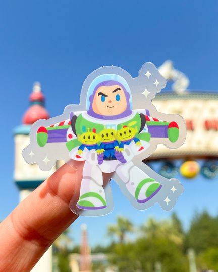Space Ranger with Aliens Toy Story Buzz Plushie Transparent Disney Laptop Sticker, planner stationery decal, water bottle, cell phone.