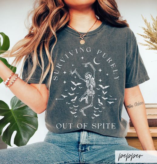 Discover Surviving Purely out of Spite Comfort Colors Shirt, Funny Goth Celestial Skeleton and Bats Shirt, Bat Lover Gothic Boho Garment Dyed T-Shirt