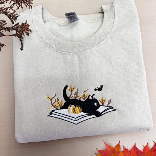 Discover Black Cat Sweatshirt, Book Crewneck, Embroidered Halloween Sweatshirt, Halloween Cat Shirt, Fall Sweatshirt for Women,Halloween Gift For Her