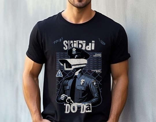 Discover Skibidi Do Da Camera Man Graphic T-Shirt, Meme Tee, Joke T-Shirt, Funny Tee, Comfortable and Soft Tee, Gamer Graphic Tee, Brain Rot T-Shirt
