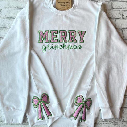Embroidered Side Bow Merry Grin Christmas Sweatshirt, funny character Glitter Embroidered Christmas Gift, Holiday funny character Crewneck, Pink Green