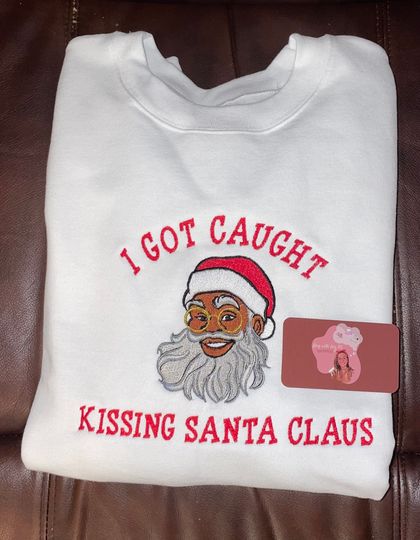 I Got Caught Kissing Santa Claus Embroidered Crewneck Sweatshirt, Funny Christmas Shirt, Black Santa Claus