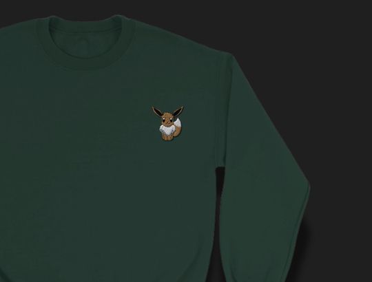 poket mons-Inspired Crewneck Sweatshirt | Minimalist Embroidered Eevee Design | Unisex Anime Sweater | Soft Cotton Blend | Subtle poket mons Merch