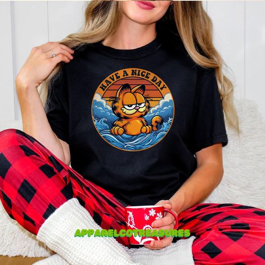 Discover Garfield Have a Nice Day T-Shirt  Funny Cartoon Cat Tee  Unisex Graphic Movie Shirt  Gift for Garfield Fans and Comic Lovers