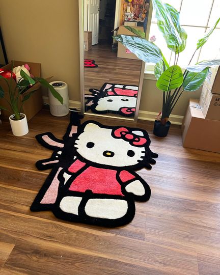 Kitty with an AK Rug