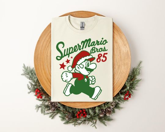 Discover Super Mario Christmas Shirt, Retro Bros 85 Holiday Tee, Funny Xmas Gift T-Shirt for Men Women Kids, Santa Hat Mario
