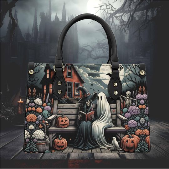 Discover Halloween witch and a ghost reading a book haunted house pumpkin witchy forest whimsical design  shoulder tote purse Vegan leather No strap