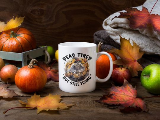 Discover Spooky Halloween Mug, Dead Tired but Still Flying Mug, Cryptic Halloween Skeleton Fun Mug