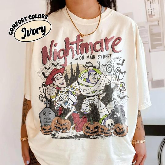 Discover Retro Nightmare On Main Street Halloween Shirt, Disney Halloween Woody Buzz Lightyear Mummy Tee, Family Matching Disney Trip Shirt 2025 Tee