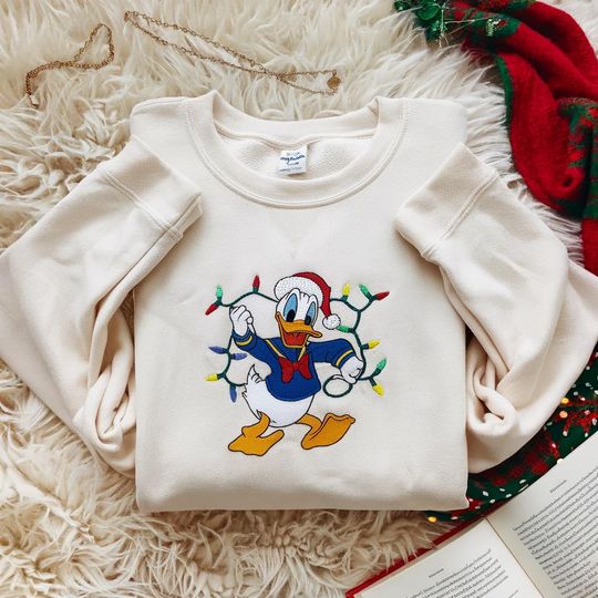 Discover Embroidered Donald Very Merry Xmas Party Sweatshirt, Mickey and Friends Disney Christmas Lights Shirt, Family Matching Shirt, Christmas Gift