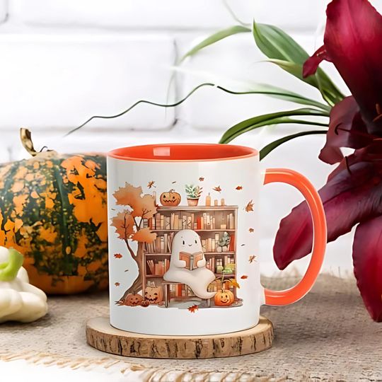 Discover Cute Ghost Halloween Mug | Spooky Fall Coffee Cup with Pumpkins & Bookshelf | Autumn Witchy Gift, Cozy Ghost Mug, Halloween Giftable