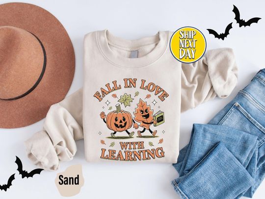 Discover Fall In Love With Learning Sweatshirt: Funny Pumpkin Hoodies, Teacher Halloween Sweater, Fall Vibes Teacher - HC144