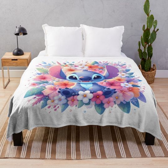 Discover Stitch sitting with a beautiful bouquet of flowers Throw Blanket