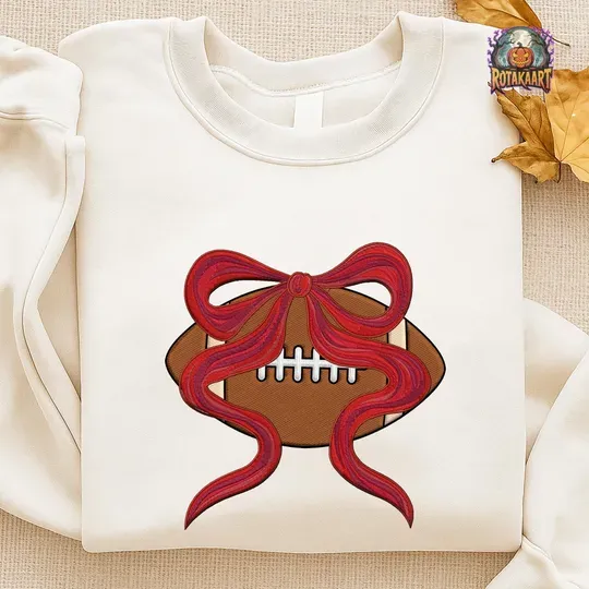 Discover Football Coquette Embroidered Sweatshirt, Football With Bow Embroidered Shirt, Cute Sports Ball Shirt, Tis The Season Halloween Embroidery