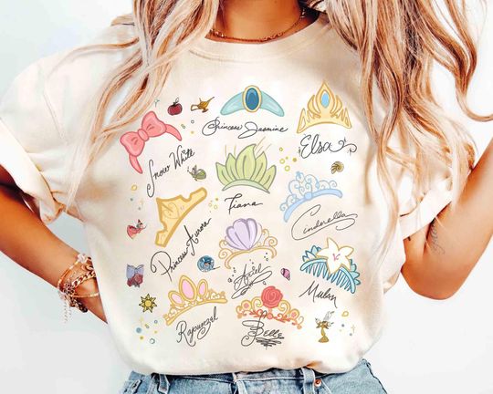 Discover Watercolor Coquette Disney Princess Crowns T-Shirt, Disney Aurora Ariel Belle Cinde Tiana Tee, Magic Kingdom Disneyland Girl Trip 2025
