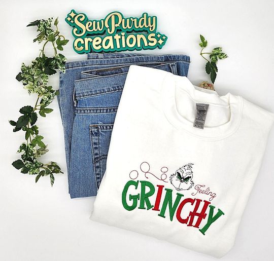 Discover funny character Christmas embroidered sweatshirt, Feeling Grin crewneck