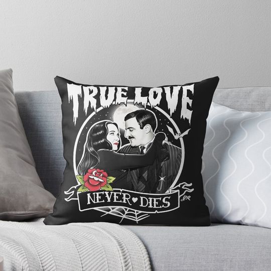 Discover Morticia and Gomez  Pillow