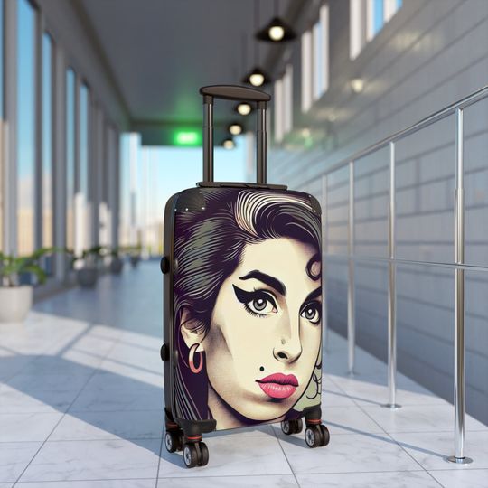 Discover our elegant and durable travel suitcase, ideal for all your trips, Lightweight, spacious and secure, Amy Winehouse Suitcase