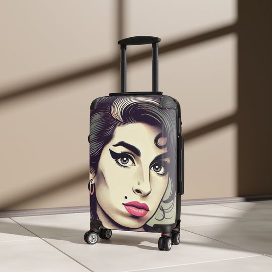Discover our elegant and durable travel suitcase, ideal for all your trips, Lightweight, spacious and secure, Amy Winehouse Suitcase