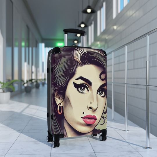 Discover our elegant and durable travel suitcase, ideal for all your trips, Lightweight, spacious and secure, Amy Winehouse Suitcase