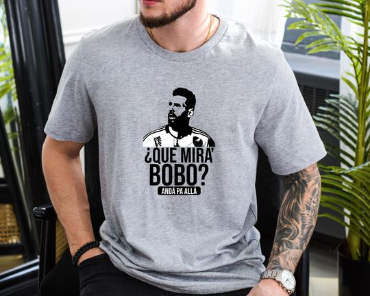 Discover Qu miras, bobo? And para all, Lionel Messi Shirt, Unisex Tee, Que Mira Bobo Anda Pa Alla, World Cup 2022, Messi Shirt