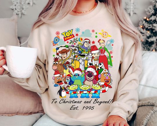 Discover Vintage Toy Story To Christmas And Beyond Shirt 2025 | Retro Disney Pixar Holiday Sweatshirt | Family Matching Tee