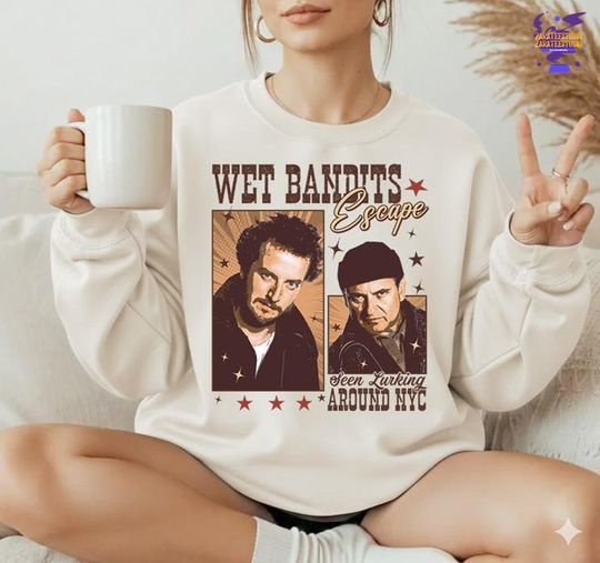 Discover Comfort Colors Wet Bandit Escape Seen Lurking Around NYC Shirt, Funny Christmas Shirt, Christmas Movie Shirt, Harry And Marv Christmas Shirt