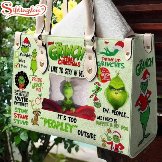 Discover The funny character Stole Christmas Leather Handbag