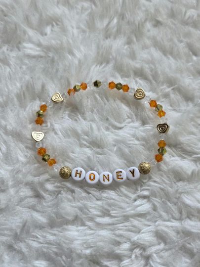 Discover Honey - Taylorr Swifts The Life of a Showgirl Inspired Friendship Bracelet