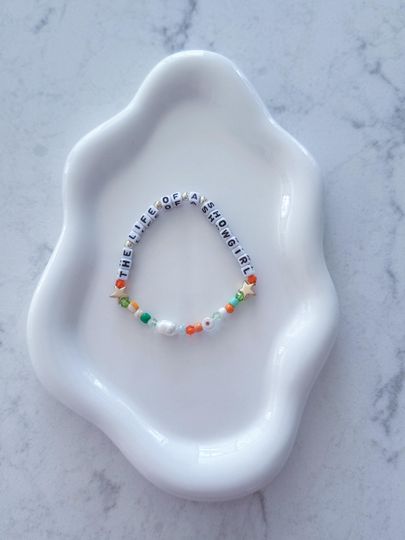 Discover Showgirl Inspired Beaded Bracelet  Freshwater Pearls, Plated Beads & Evil Eye Charm  Color Theme Jewelry