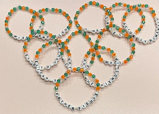 Discover The Life of a Show Girl Bracelet. A mix of Orange, Green, and Pearl beads inspired by Taylorr Swifts's, The Life of a Show Girl Album