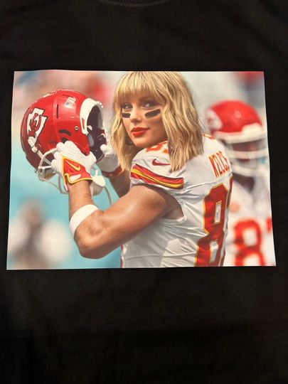 Discover TSwift/Travis Kelce mashup Premium T shirt in Mens sizes S-3XL in White or Black! Heat Pressed on Kirkland brand T-Shirts!