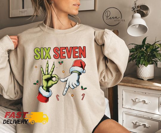 Discover Funny Six Seven Christmas Sweatshirt: 6 7 Santa Hand Sign Hoodie