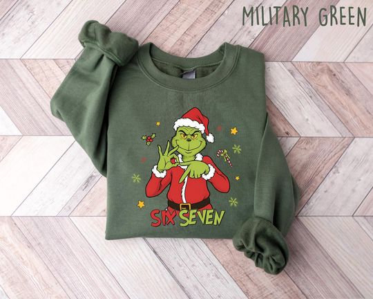 Discover Funny Six Seven Meme Christmas Mean Guy Sweatshirt, Viral Funny 6 7 Christmas Shirt, Internet Joke, Xmas 6 7 Christmas Movie Shirt
