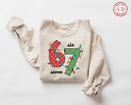 Discover Funny Six Seven Meme Christmas Sweatshirts , Viral Funny Saying 6 7 Tee, Festive Holiday Shirt, Christmas Party