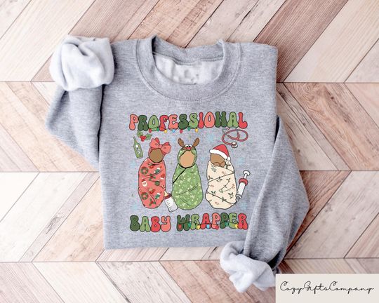 Discover Labor And Delivery Christmas Sweatshirt, Professional Baby Wrapper L&D Nurse Christmas T-Shirt, Labor Nurse Gifts, Xmas Nurse Specialist Tee