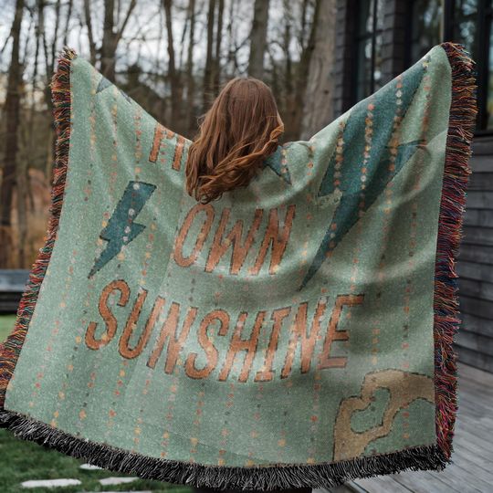 Discover Showgirl Era Woven Blanket with Fringed Edges, Dancing Through the Lightening Strikes