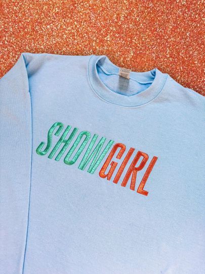 Discover SHOWGIRL embroidered crewneck sweatshirt