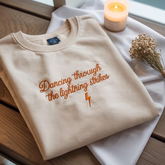 Discover Embroidered Dancing Through the Lightning Strikes Shirt, But Now The Sky Is Opalite Shirt, Gift for Her, Music Shirt, Concert Shirt
