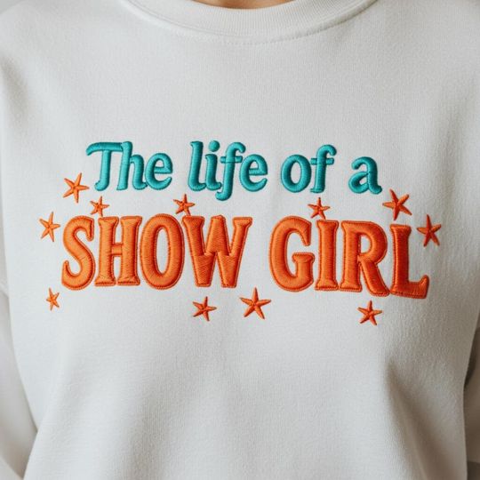 Embroidered Showgirl Crewneck: Orange Show Girl Shirt