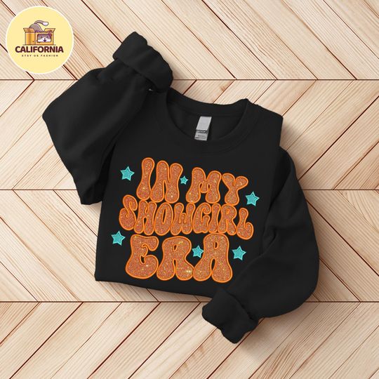 Discover Embroidered In my Showgirl Era Shirt, Orange Show Girl Shirt, Showgirl Era shirt, Gift for Her, The Life Of A Show Girl, Glitter Applique