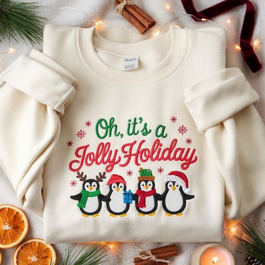 Discover EMBROIDERED Christmas Penguin Sweatshirt, Jolly Holiday Sweater, Cute Winter Crewneck, Holiday Penguin Shirt, Cozy Xmas Tee, Merry Christmas