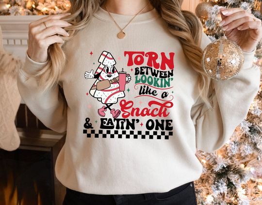 Discover Snack vs Snackin' Christmas Sweatshirt: Funny Holiday Treat Design