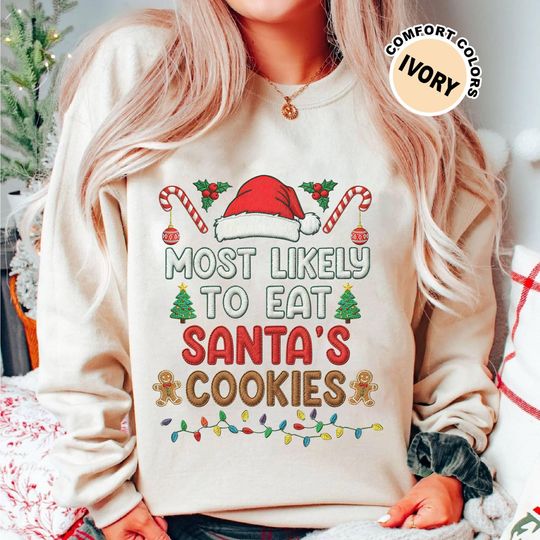 Discover Most Likely To Eat Santa's Cookies Embroidered Effect Sweatshirt, Family Matching Christmas Trip Shirt, Funny Xmas Party 2025 Gifts Shirt